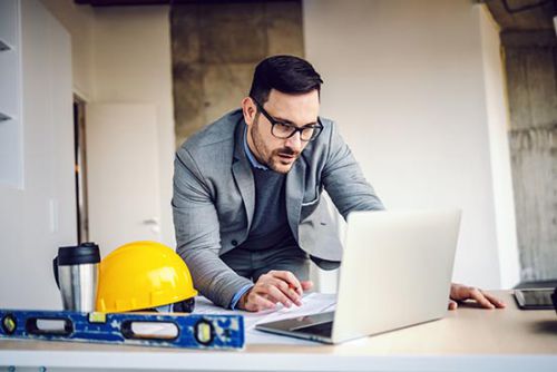 construction project documentation, man in construction site office